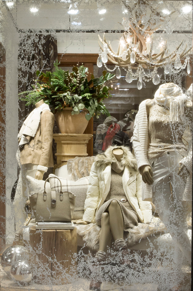Ralph Lauren Harriman holiday window display with frosted glass and antler chandelier