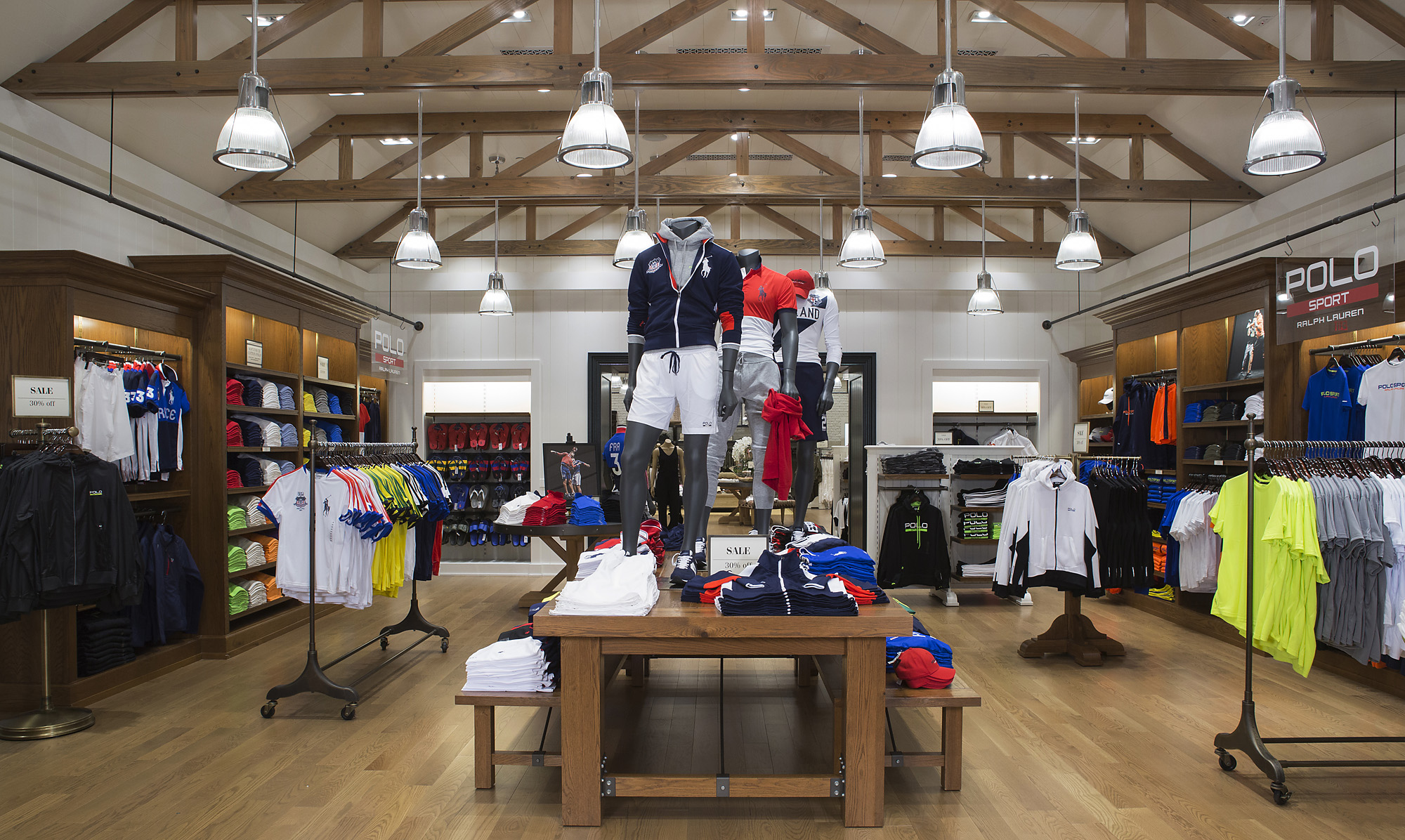 Polo Sport department with exposed timber beams, pendant lighting and athletic merchandise