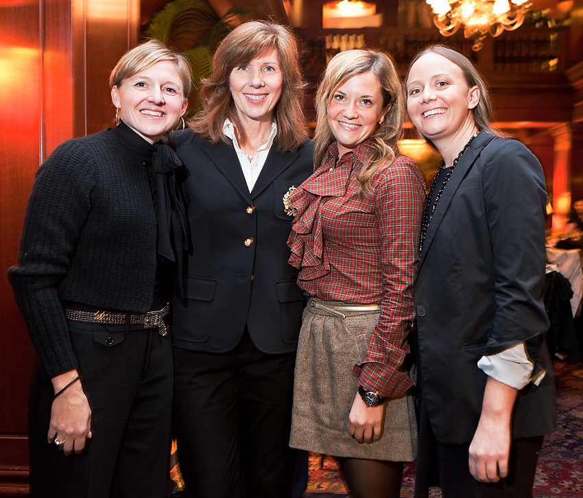 Group of four guests posing together