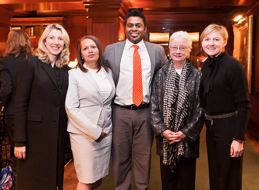 Group of five guests posing together