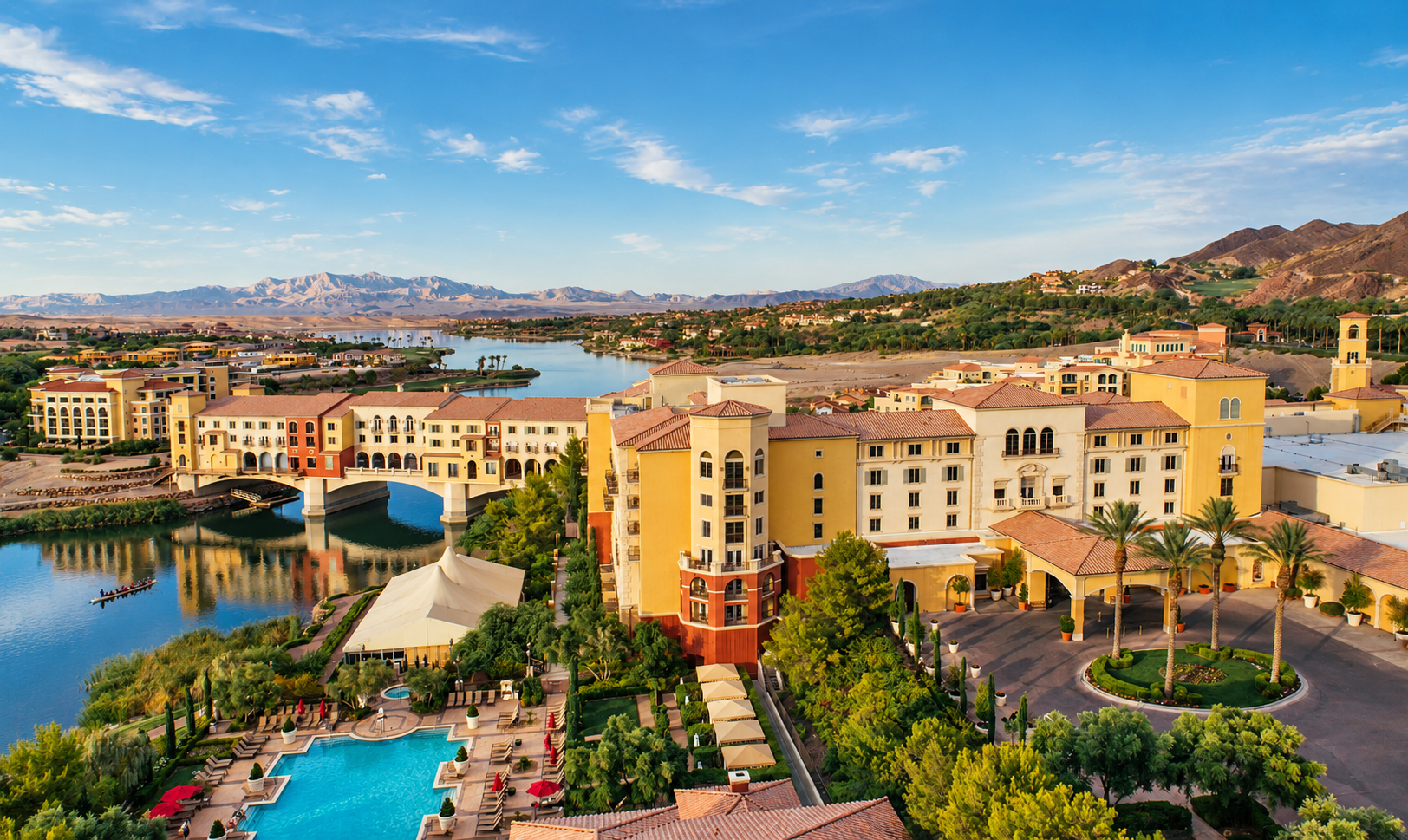 Aerial view of the Lake Las Vegas resort venue, with the lake, pool, palm trees and mountains surrounding the Ralph Lauren conference site