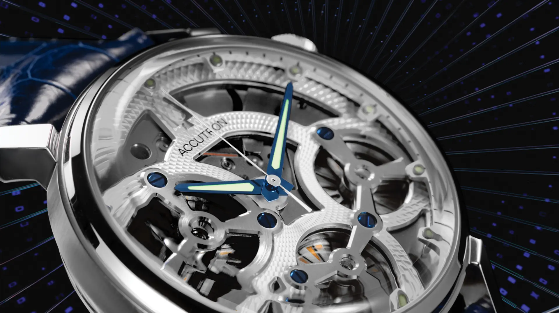 Close-up of an Accutron skeleton watch dial with blue hands against a dark radiating background